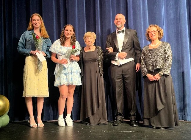 2025 scholarship winners posing on stage